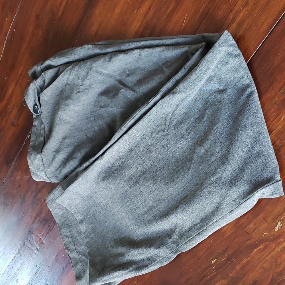 Grey pants with 2 pockets on back with buttons and 2 side pockets on front